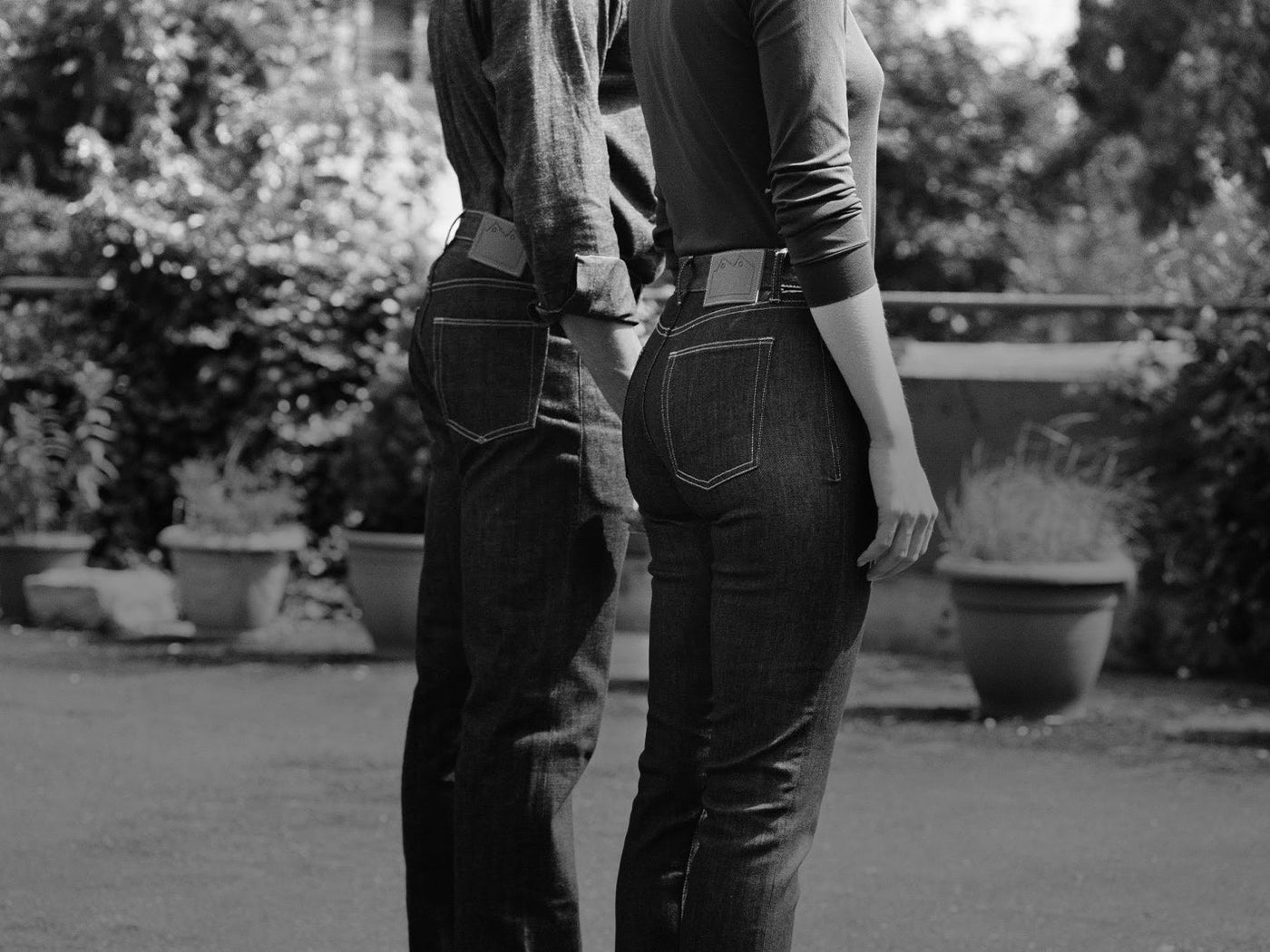 black and white image of man and woman denim jeans